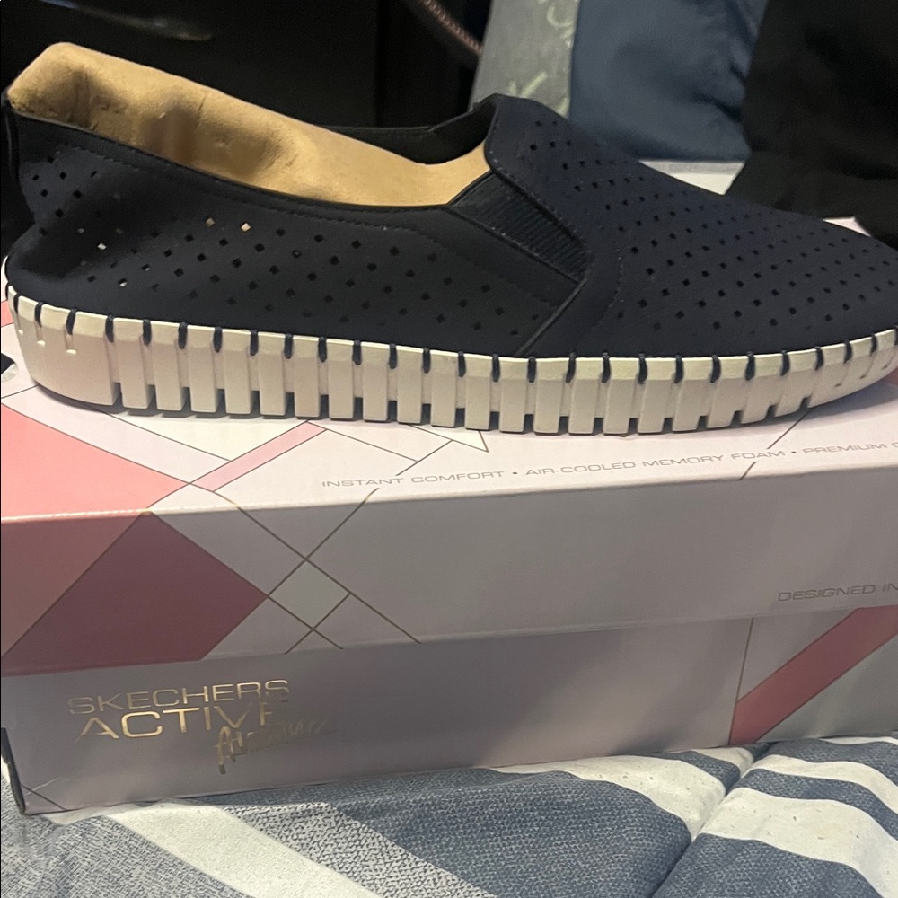 Skechers women’s Navy Perforated Slip-On Sneakers